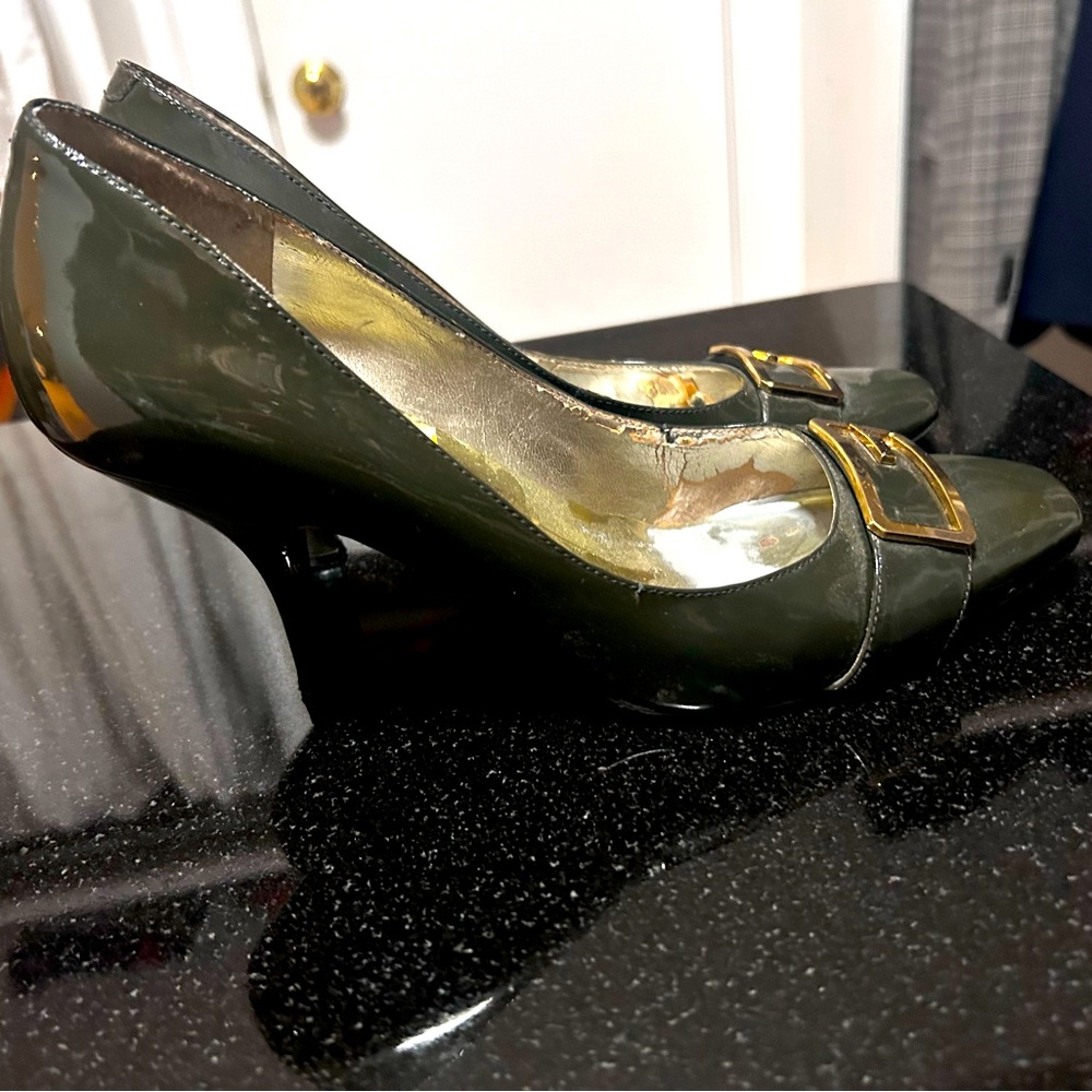 Guess brand high heels, size 8, green with a gold buckle.